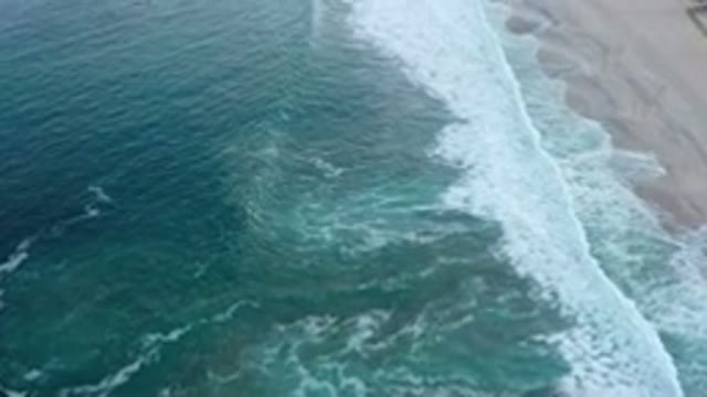 SAN JOSE DEL CABO MEXICO-2020: Waves Crash Against A Sandy Beach On A Sunny Day