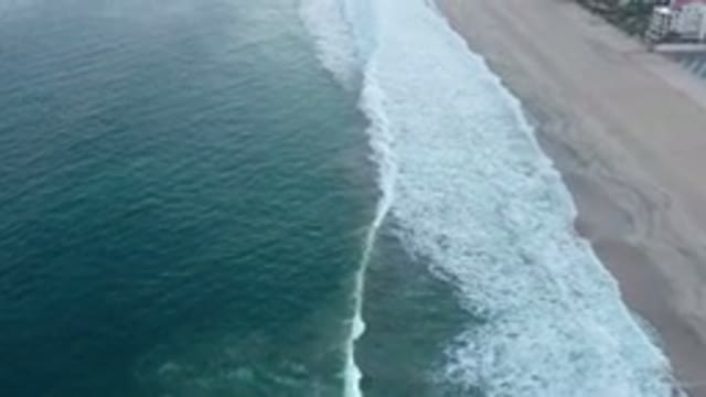 SAN JOSE DEL CABO MEXICO-2020: Moving Shot Of White Capped Waves Rolling Up To