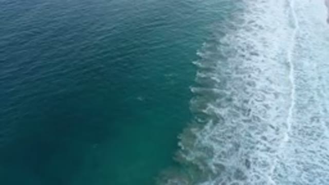 SAN JOSE DEL CABO MEXICO-2020: Rolling Blue And Green Ocean Waves With Foam At