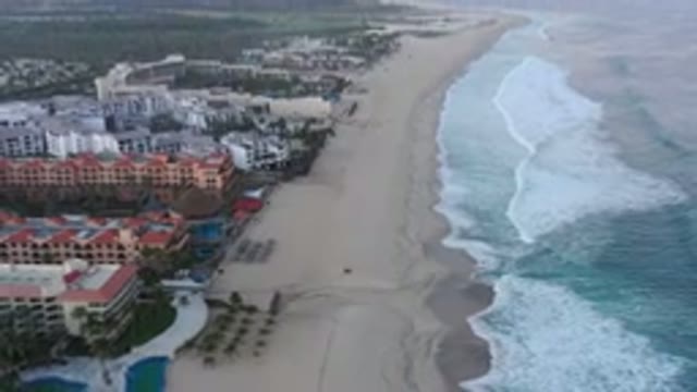 SAN JOSE DEL CABO MEXICO-2020: Large Sandy Shoreline With Buildings Inland And