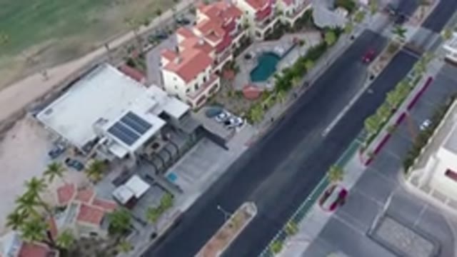 SAN JOSE DEL CABO MEXICO-2020: Flying Over The Large Building With A Red Roof