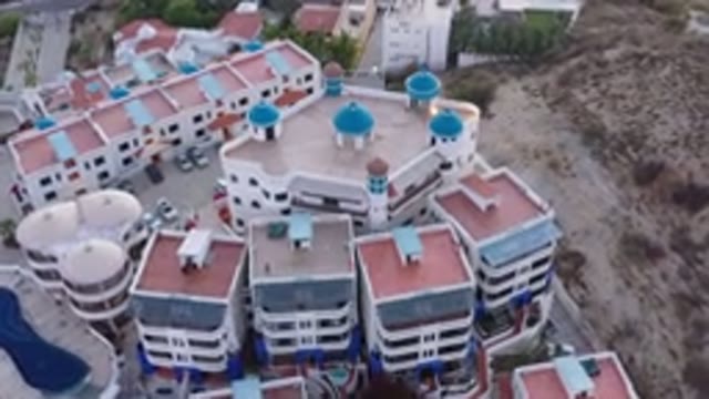 SAN JOSE DEL CABO MEXICO-2020: Red And White Buildings With Blue Towers