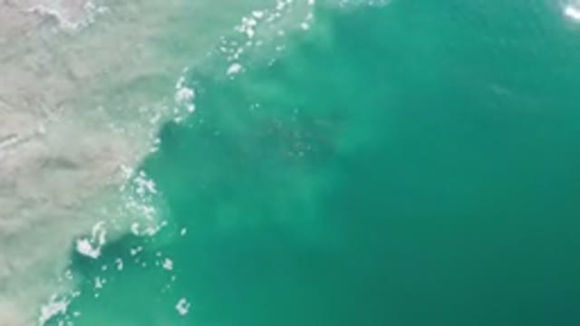 LOS CABOS MEXICO-2020: A Top View Of Green Deep Sea Water With Sand Wave And