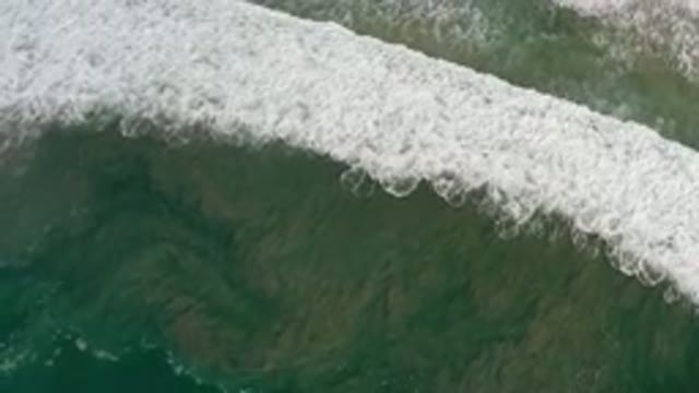 LOS CABOS MEXICO-2020: Straight Top View Of A Wide White Bubble Wave In A Beach