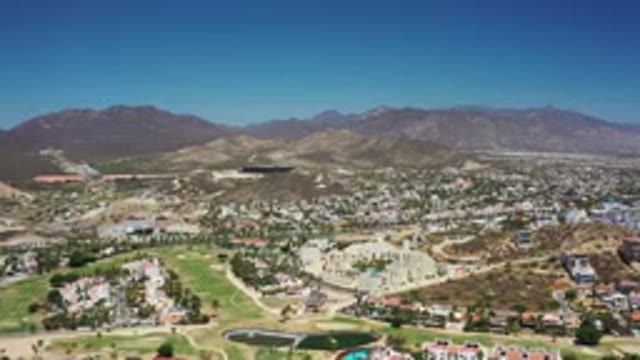LOS CABOS MEXICO-2020: A View Of A City From Above With Many Buildings And Trees