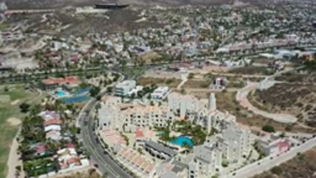 LOS CABOS MEXICO-2020: Slow Moving Aerial View Panning Over Homes On Sunny Day