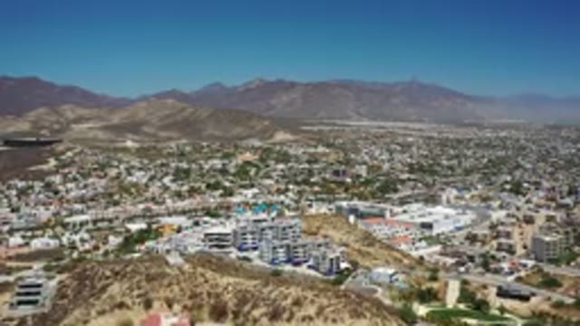 LOS CABOS MEXICO-2020: A View Of The City With Mountains And Buildings Shown