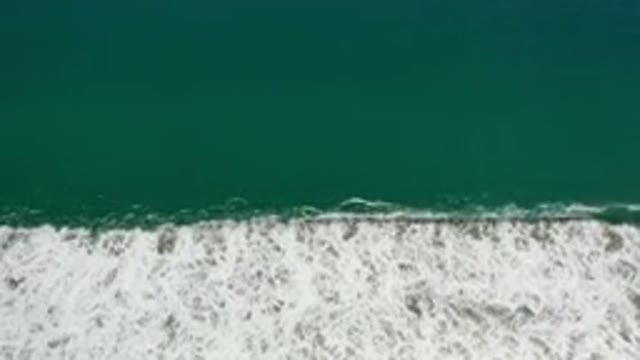 LOS CABOS MEXICO-2020: Beautiful Green Water Calm Sea Waves Crashing At The Beach