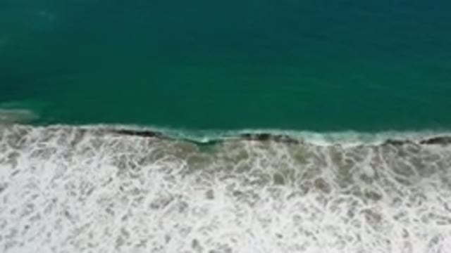 LOS CABOS MEXICO-2020: Waves Rolling From the Seashore with Green Sea and White Foam