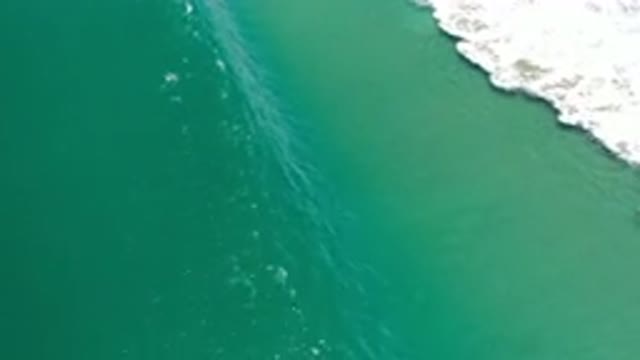 LOS CABOS MEXICO-2020: Crashing Green Waves Against Empty Beach From Above