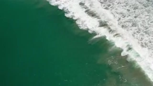 LOS CABOS MEXICO-2020: Deep And Green Sea Water With Wide White Bubbled Wave