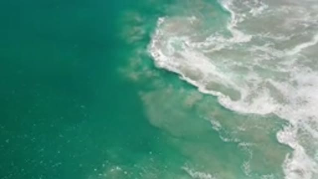 LOS CABOS MEXICO-2020: Deeply Blue Ocean With Waves Calmly Crashing At The Beach