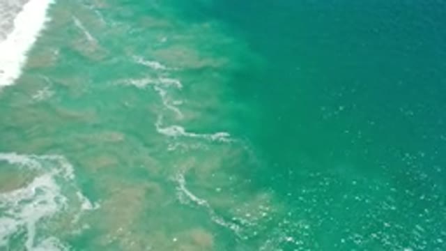 LOS CABOS MEXICO-2020: Light Fluffy Waves in Beautiful Blue Sparkling Salty