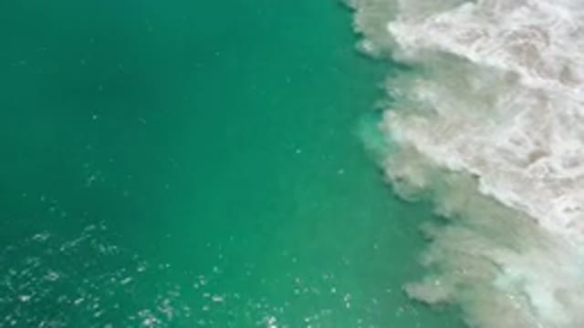 LOS CABOS MEXICO-2020: Large Body Of Water With A Dark Shadow And Sun Shimmering