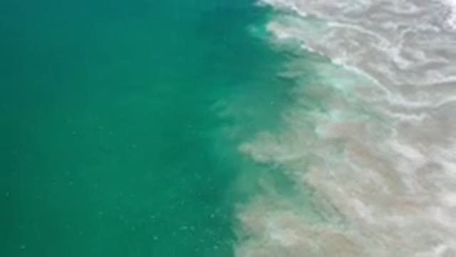 LOS CABOS MEXICO-2020: Top View Of Deep Green Sea With A Wild White Bubble Wave