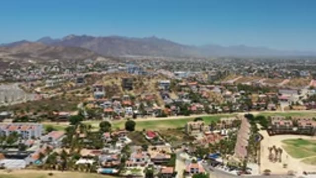 LOS CABOS MEXICO-2020: Drone View of Buildings Trees Green Grass and Small Open Places