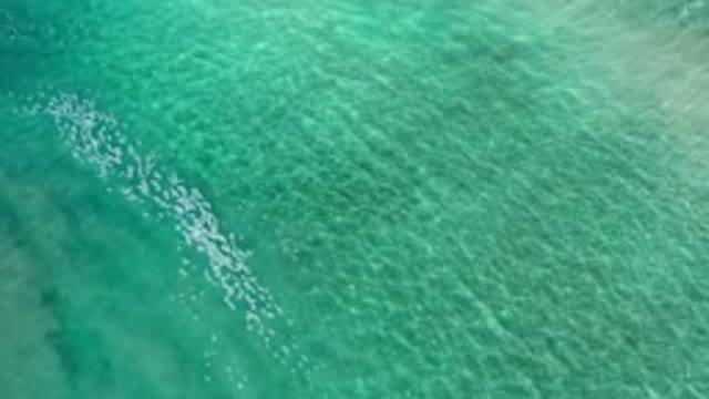 LOS CABOS MEXICO-2020: Calm Tiny Waves On A Deep Green Ocean