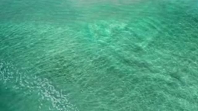 LOS CABOS MEXICO-2020: Crystal Clear Blue Green Water Is Rocked By A Wave As It