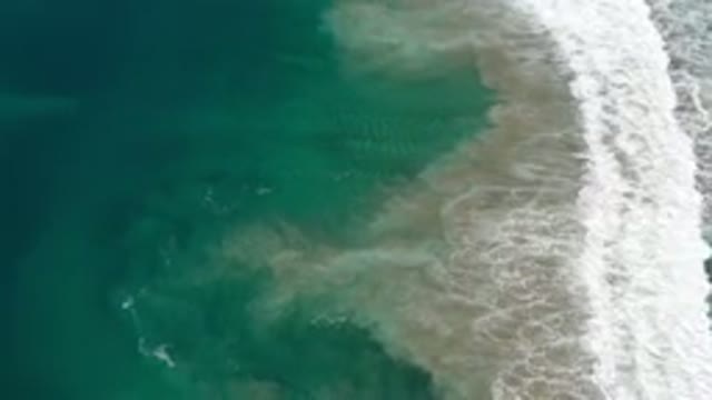 LOS CABOS MEXICO-2020: Top View Of A Beach White Bubble Wave And Moving Sand