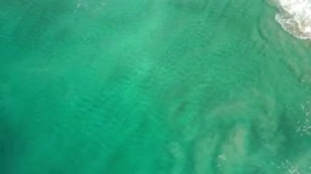 LOS CABOS MEXICO-2020: Rotating Aerial View Of Crystal Clear Peaceful Blue Green Waters