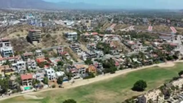 LOS CABOS MEXICO-2020: Aerial View Of Buildings Roads Trees And Mountains From Above