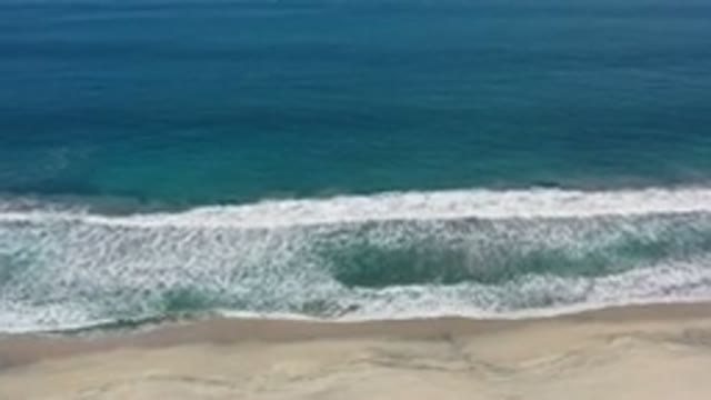 LOS CABOS MEXICO-2020: Amazingly Blue Water Sea With Waves Slowly Crashing At