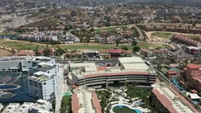 LOS CABOS MEXICO-2020: A Moving Camera Captures a Crowded City with Modern Buildings