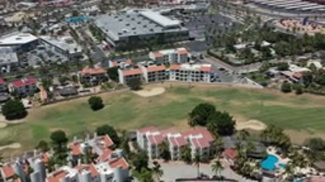 LOS CABOS MEXICO-2020: Birds-Eye View Of Tall Buildings Pool Grass Trees And