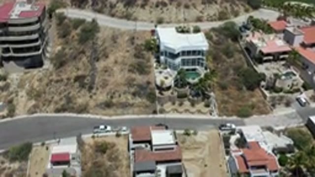 LOS CABOS MEXICO-2020: Aerial View Of Buildings Greens Streets And Cars From Above