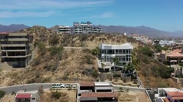 LOS CABOS MEXICO-2020: Descending Drone Shot Of Modern Built Houses In Desert