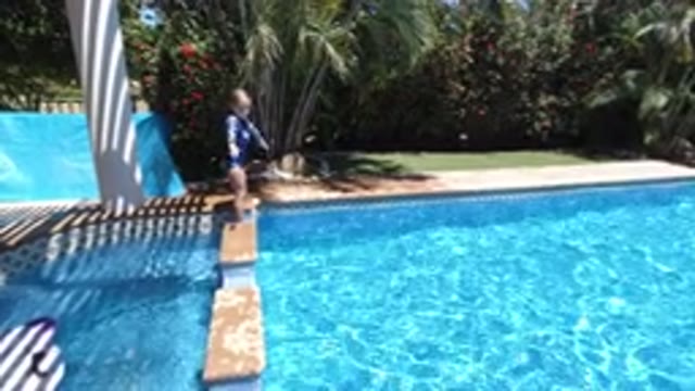 LOS CABOS MEXICO-2020: Little Blonde Girl Having Fun In The Backyard Pool