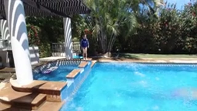 LOS CABOS MEXICO-2020: Little Girl And Big Brother Having Fun In The Pool During