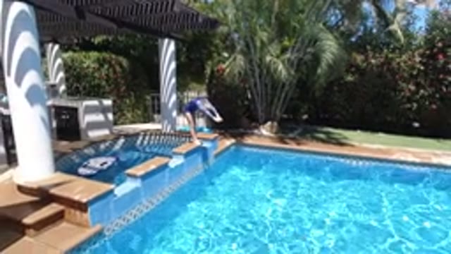 LOS CABOS MEXICO-2020: Girl About To Dive Into A Huge Beautiful Backyard Pool