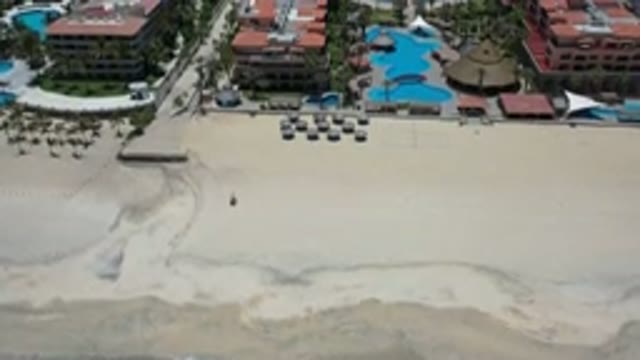 LOS CABOS MEXICO-2020: A Wide Sand Beach And Big Buildings With Big Water Pools