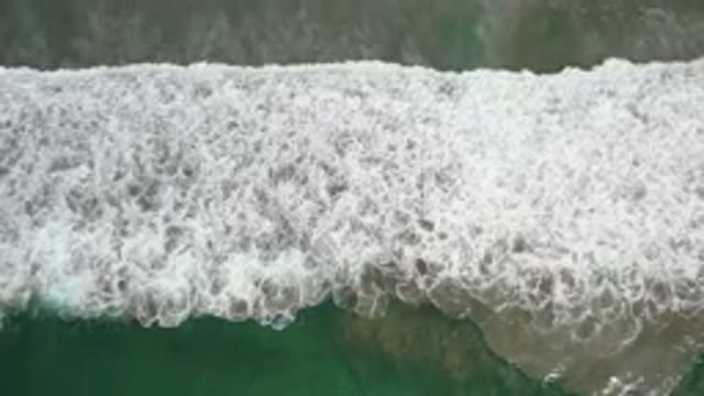 LOS CABOS MEXICO-2020: A Wide White Bubble Wave On A Long Beach