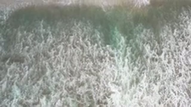 LOS CABOS MEXICO-2020: Top View Of A Wide White Bubble Wave On A Sandy Beach