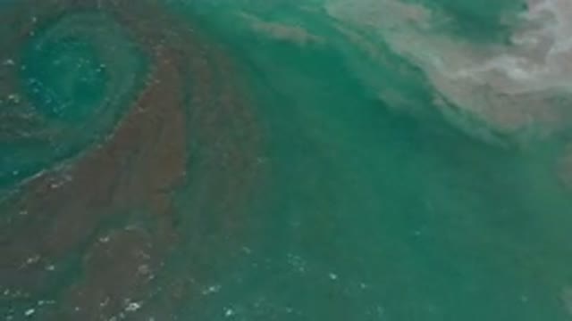 LOS CABOS MEXICO-2020: Ocean Water Moving Smoothly With Brown Swirls And White