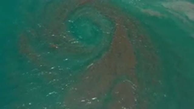 LOS CABOS MEXICO-2020: Swirl In A Blue Sea With Waves Rippling