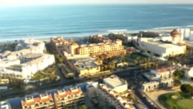LOS CABOS MEXICO-2019: Timelapse Aerial Shot Of Cars Passing By And Waves