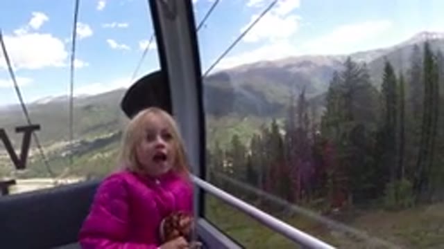 WINTER PARK COLORADO-2019: Little Blonde Girl Having Fun In The Cableway With