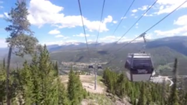 WINTER PARK COLORADO-2019: Black Air Cabs Gliding Across Woody Beautiful Landscape
