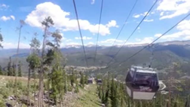 WINTER PARK COLORADO-2019: View From A Gondola Going Up A Mountain Surrounded By Trees