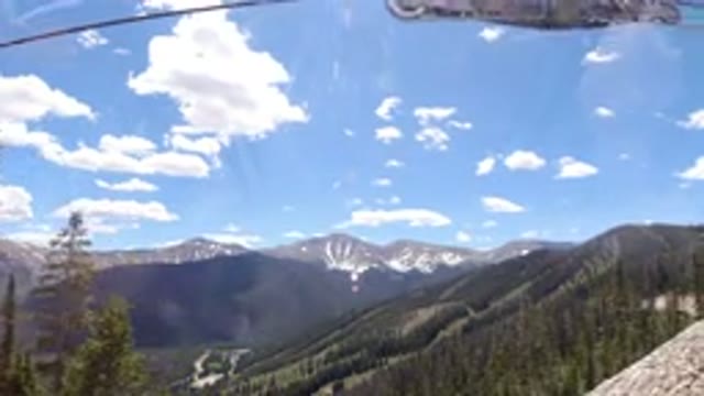 WINTER PARK COLORADO-2019: Moving Ski Lift Beautiful View Showing Mountains Sky