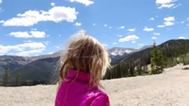 WINTER PARK COLORADO-2019: A Kid Is Walking On A Path In The Nature On A Sunny Day