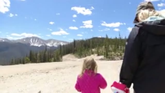 WINTER PARK COLORADO-2019: Lady With Her Daughter Walking Near The Mountains And