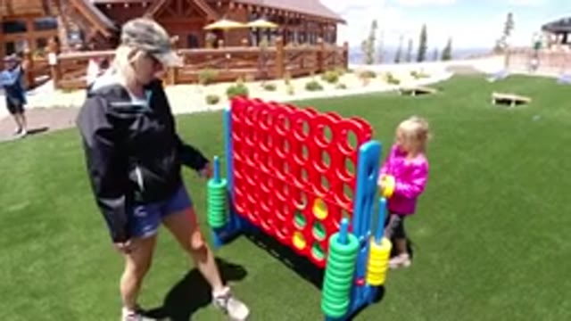 WINTER PARK COLORADO-2019: Mother And Daughter Playing Together Having Fun In Snow