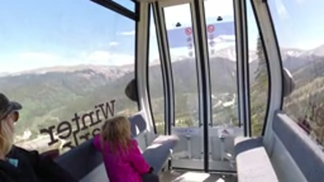 WINTER PARK COLORADO-2019: A Lady And Little Girl Ride In Air Cab