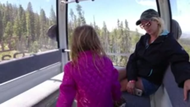 WINTER PARK COLORADO-2019: Mother and Daughter Riding Bucket Lift in Mountains