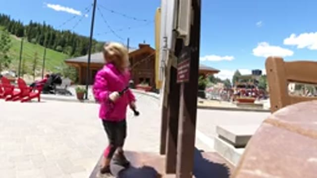 WINTER PARK COLORADO-2019: A Young Girl In A Park Drumming On A Sideboard With