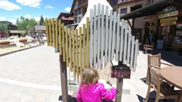 WINTER PARK COLORADO-2019: A Kid Holding A Stick Like Object And Hitting It